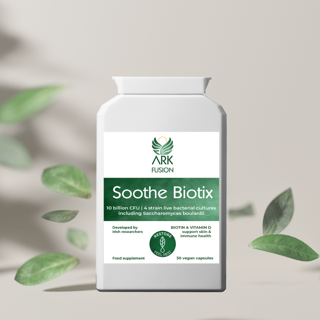 Photorealistic mockup of Soothe Biotix bottle by ARK Fusion, surrounded by floating green leaves. Clean, soft background. Green label shows key benefits: biotin, vitamin D, gut and skin support, and 10 billion CFU.
